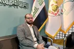 اهدای پرچم حرم حسینی در نمایشگاه قرآن + عکس