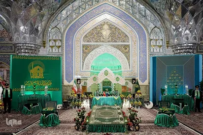 آیین تعویض پرچم گنبد منور رضوی در روز میلاد امام رضا(علیه‌السلام)