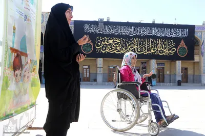 آیین سیاه‌پوشان و تعویض پرچم گنبد حرم حضرت شاهچراغ‌(ع)