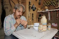 Kaligrafi Alquran di atas Butiran Beras oleh Seniman Suriah