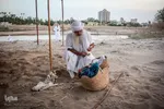 مراسم غسل تعمید منداییان در کنار رودخانه کارون