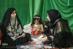 آماده‌سازی لباس همایش جهانی شیرخوارگان حسینی