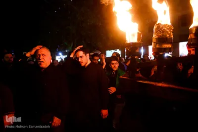 آیین مشعل گردانی نجفی‌های مقیم مشهد در شب تاسوعا‎
