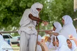 مراسم غسل تعمید منداییان در کنار رودخانه کارون