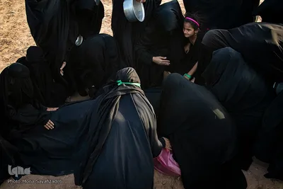 آیین نمادین خاکسپاری پیکرهای شهدای کربلا در حمیدیه