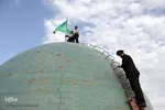 تعويض پرچم گنبد امامزاده علي بن جعفر(ع)