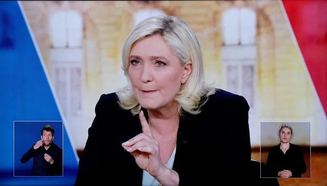 Macron says Le Pen’s Anti-Hijab Plan Can Spark Civil War