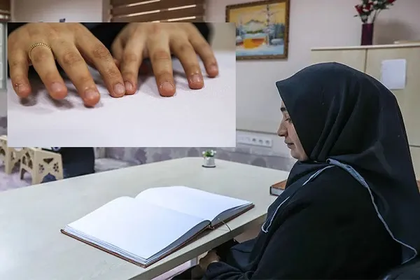 Görmə məhdudiyyətli xanım Quran öyrədir