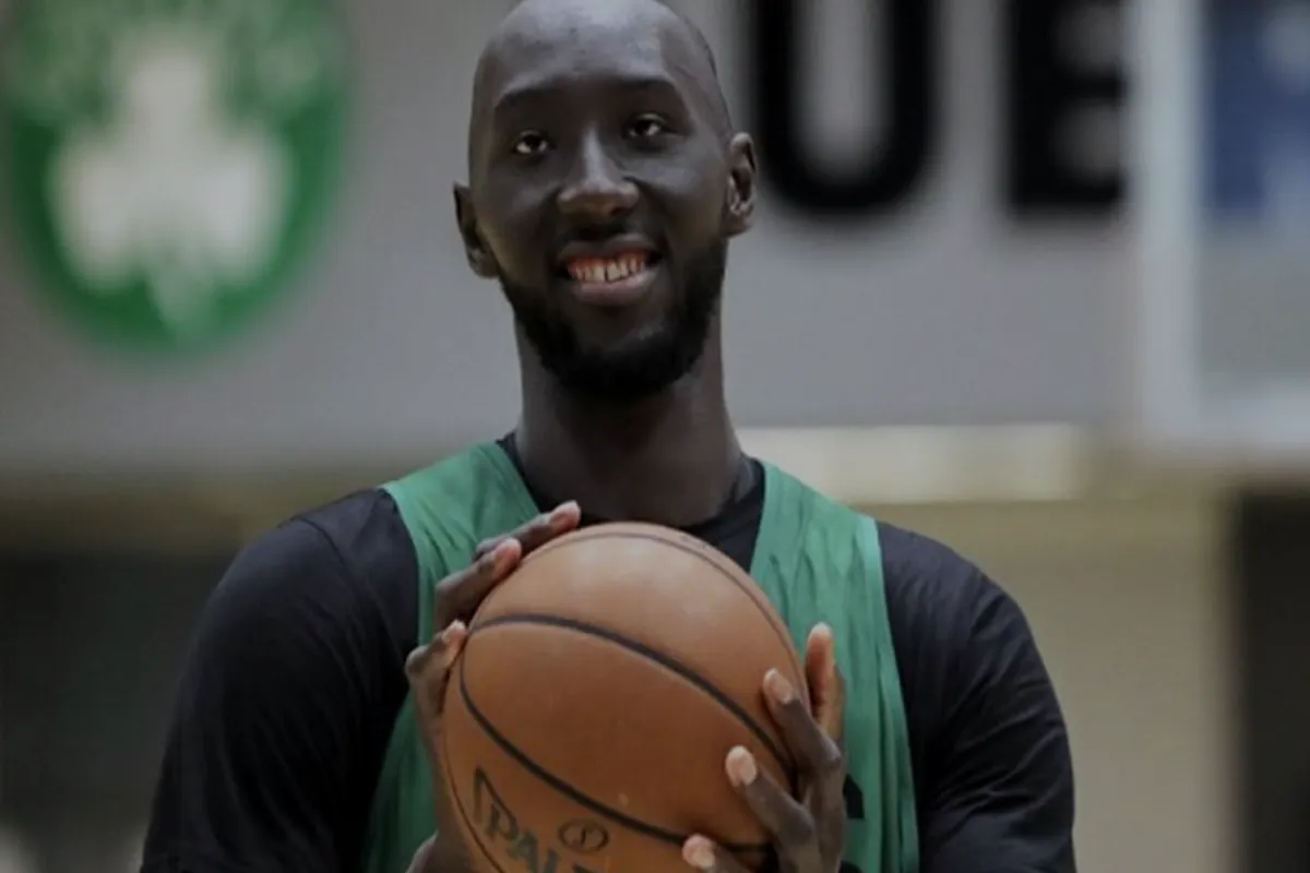 Muslim Basketball Player Tacko Fall Hands Out Signed Book at Austin Islamic Center