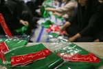 آماده‌سازی لباس همایش جهانی شیرخوارگان حسینی