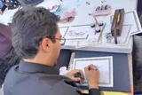 نقش‌آفرینی هنر خوشنویسی و تعزیه ملایری‌ها در بدرقه رهبر شهید