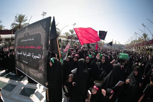 بالصور...تنظيم مسيرة قرآنية سنوية لحافظات القرآن في العراق