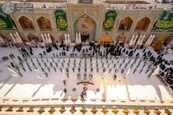 La cérémonie du changement du drapeau du mausolée du vénéré l'imam Ali (As) à Najaf