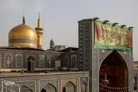 آیین تعویض پرچم گنبد حرم مطهر امام رضا(ع)