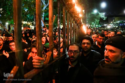 آیین مشعل گردانی نجفی‌های مقیم مشهد در شب تاسوعا‎
