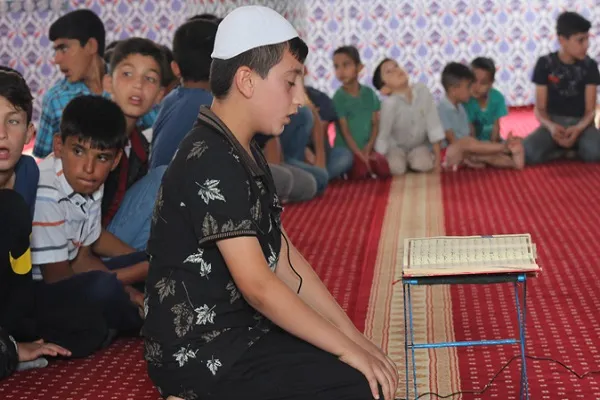 Kur'an-ı Kerim'i güzel okuyan çocuklara bisiklet