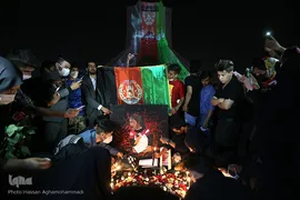 نورپردازی ۳ بعدی تسلیت و همبستگی با ملت مسلمان افغانستان بر روی برج آزادی به مناسبت حادثه تروریستی مدرسه دخترانه در کابل