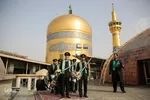 آیین تعویض پرچم گنبد حرم امام رضا(ع)
