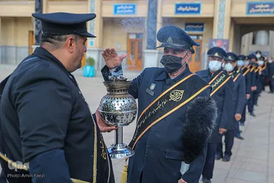 مراسم تعویض پرچم گنبد حرم حضرت شاهچراغ (ع)