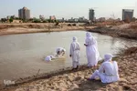 مراسم غسل تعمید منداییان در کنار رودخانه کارون