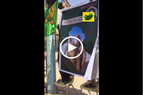 موكب عراقي للزيارة الأربعينية يرفع صور شهداء قادة النصر