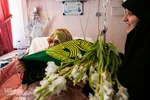 عیادت از بیماران توسط خادمین حرم امام رضا (ع)