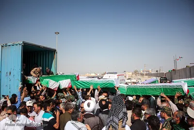 مراسم استقبال از پیکرهای 44 شهید تازه تفحص شده دوران دفاع مقدس در مرز بین المللی شلمچه برگزار شد