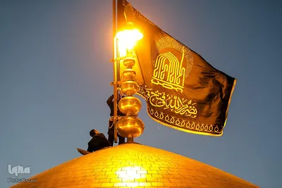 مراسم تعویض پرچم گنبد مطهر حرم امام رضا(علیه‌السلام)