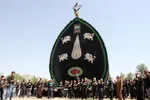 آیین نخل گردانی ظهر عاشورا در شاهدیه یزد