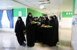 عیادت از بیماران توسط خادمین حرم امام رضا (ع)