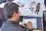 نقش‌آفرینی هنر خوشنویسی و تعزیه ملایری‌ها در بدرقه رهبر شهید