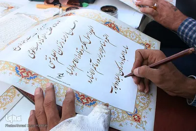 بداهه‌نويسی خوشنويسان شيرازی در جشن ميلادامام رضا(ع)