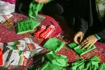 آماده‌سازی لباس همایش جهانی شیرخوارگان حسینی
